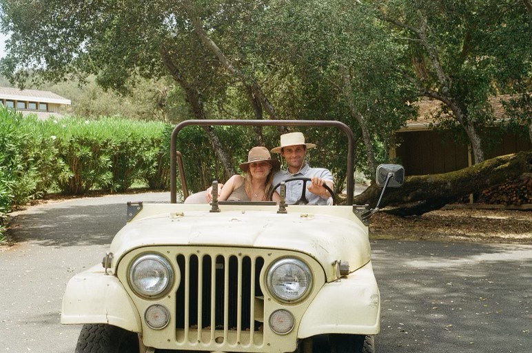 Claire and Willy in the jeep at the ranch